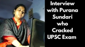 மடிக்கணினியோடு அமர்ந்திருக்கும் பூரணசுந்தரி புகைப்படம்